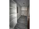 Laundry room with storage cabinets and gray wood-style flooring at 2204 Liberty Sw Ln, Conyers, GA 30094
