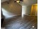 Bright living room features vaulted ceilings, wood-look floors, and neutral walls at 2204 Liberty Sw Ln, Conyers, GA 30094