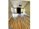 Spacious living room features a brick fireplace, vaulted ceilings, and stylish wood-look flooring at 2204 Liberty Sw Ln, Conyers, GA 30094