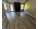 Inviting living room featuring new floors and a brick fireplace at 2204 Liberty Sw Ln, Conyers, GA 30094
