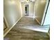 Open living room with gray flooring and views to connecting rooms at 2204 Liberty Sw Ln, Conyers, GA 30094