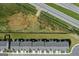Birds eye shot reveals the backs of townhomes along with a highway and green space in the background at 8714 Lakeview Commons # 48, Jonesboro, GA 30238