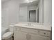 Well-lit bathroom with white vanity, toilet, tub-shower, and a large mirror at 8714 Lakeview Commons # 48, Jonesboro, GA 30238
