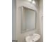 Clean bathroom with a stylish mirror, vanity sink, and neutral wall color at 8714 Lakeview Commons # 48, Jonesboro, GA 30238
