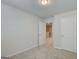 Bright bedroom with neutral walls and carpet, featuring a closet and an open doorway leading to the hallway at 8714 Lakeview Commons # 48, Jonesboro, GA 30238