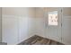 Bright entryway with white wainscoting and a view of the outdoors through the glass door at 8714 Lakeview Commons # 48, Jonesboro, GA 30238