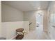 Neutral hallway with access to a bedroom featuring a ceiling fan and natural light at 8714 Lakeview Commons # 48, Jonesboro, GA 30238