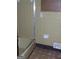 Cozy bathroom with tile walls, tiled flooring and a shower with a sliding door at 7225 Pineneedle Sw Dr, Covington, GA 30014