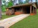 Charming brick home with a covered carport and front entrance at 7225 Pineneedle Sw Dr, Covington, GA 30014