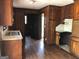 Kitchen with wood cabinets and trim at 7225 Pineneedle Sw Dr, Covington, GA 30014