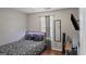 Cozy bedroom featuring a stylish bed frame, hardwood floors, and a large window at 1401 Aberdeen Ct, Mcdonough, GA 30253