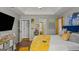 Spacious bedroom with tray ceiling, carpet, and a view into an additional room at 1401 Aberdeen Ct, Mcdonough, GA 30253