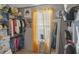 Walk-in closet with built-in shelving, racks for clothing, mirrors and natural light at 1401 Aberdeen Ct, Mcdonough, GA 30253