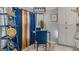 Stylish dining area with a unique decorative rack, a table with blue chairs, and lots of bright light at 1401 Aberdeen Ct, Mcdonough, GA 30253