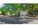 A detached two-car garage and spacious driveway complement this traditional home's exterior at 1401 Aberdeen Ct, Mcdonough, GA 30253