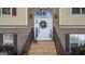 Close-up of an inviting front door with decorative wreath, framed by brick and sidelight windows at 1401 Aberdeen Ct, Mcdonough, GA 30253