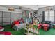 Finished garage with epoxied floor and painted walls offering potential as a flexible recreation or living space at 1401 Aberdeen Ct, Mcdonough, GA 30253
