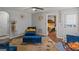 Comfortable living room with modern furnishings, view into bedroom, and easy access to other living spaces at 1401 Aberdeen Ct, Mcdonough, GA 30253