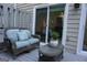 Enjoy outdoor relaxation on the deck, featuring a cushioned wicker sofa and glass-topped table at 2566 Summit Cove Dr, Duluth, GA 30097