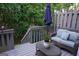 A beautiful deck features a comfortable wicker seating area, ideal for enjoying outdoor relaxation at 2566 Summit Cove Dr, Duluth, GA 30097