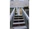 Deck stairs lead up to the patio, providing a transition from the yard to the outdoor living space at 2566 Summit Cove Dr, Duluth, GA 30097