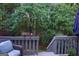 Relaxing back deck with a view of the wooded backyard, offering a private outdoor space at 2566 Summit Cove Dr, Duluth, GA 30097