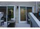 Outdoor patio with seating near sliding glass doors provides easy access to the home's interior at 2566 Summit Cove Dr, Duluth, GA 30097