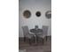 Charming breakfast nook featuring a round table, comfortable chairs, and stylish wall mirrors at 2566 Summit Cove Dr, Duluth, GA 30097