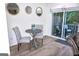 Cozy dining area featuring a round table, chairs, and sliding glass door to the outdoor deck at 2566 Summit Cove Dr, Duluth, GA 30097