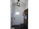 Inviting entryway featuring a stylish coat rack, bench, and a bright white front door at 2566 Summit Cove Dr, Duluth, GA 30097