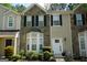 Charming townhome with stone accents, neat landscaping and a welcoming front door at 2566 Summit Cove Dr, Duluth, GA 30097