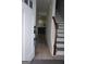 Bright entryway hall with staircase leads into the home's living area with sleek flooring at 2566 Summit Cove Dr, Duluth, GA 30097
