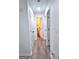 Hallway with hardwood floors leading to a bathroom and other rooms at 2566 Summit Cove Dr, Duluth, GA 30097