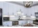 Stylish kitchen boasts white cabinetry, subway tile backsplash, stainless appliances, and granite countertops at 2566 Summit Cove Dr, Duluth, GA 30097