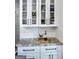 Stylish kitchen features granite countertops, modern cabinetry, tile backsplash and stainless steel appliances at 2566 Summit Cove Dr, Duluth, GA 30097