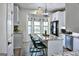 Bright kitchen with granite counters, stainless steel appliances, and breakfast bar seating by the window at 2566 Summit Cove Dr, Duluth, GA 30097