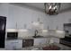 Bright kitchen with granite counters, stainless steel appliances, and a modern design at 2566 Summit Cove Dr, Duluth, GA 30097