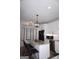 Bright kitchen with granite counters, stainless steel appliances, and a large island with seating at 2566 Summit Cove Dr, Duluth, GA 30097