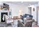 Bright living room with a fireplace, comfortable seating, and modern decor at 2566 Summit Cove Dr, Duluth, GA 30097