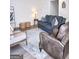 Inviting living room featuring a soft rug, ample seating, and a contemporary design at 2566 Summit Cove Dr, Duluth, GA 30097