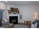 Bright living room featuring a fireplace, decor, and comfortable seating at 2566 Summit Cove Dr, Duluth, GA 30097