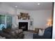 Inviting living room boasts a fireplace, comfortable seating, and sliding glass doors to the outside at 2566 Summit Cove Dr, Duluth, GA 30097