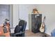 Functional home office space featuring desk, chair, filing cabinet, and guitar at 2566 Summit Cove Dr, Duluth, GA 30097