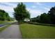 Rogers Bridge Park entrance, featuring lush greenery and ample space for walking and recreation at 2566 Summit Cove Dr, Duluth, GA 30097