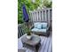 Charming patio with a wicker loveseat, glass table, umbrella and soft blue cushions, great for outdoor relaxation at 2566 Summit Cove Dr, Duluth, GA 30097