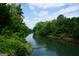 Scenic river view surrounded by lush greenery, perfect for nature lovers and peaceful recreation at 2566 Summit Cove Dr, Duluth, GA 30097