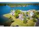 Scenic aerial perspective showcasing a community of waterfront townhomes surrounded by lush greenery and lake views at 294 Clearview Ct, Villa Rica, GA 30180
