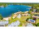 Aerial view of lakeside condos, community pool, beach, and well-maintained grounds at 294 Clearview Ct, Villa Rica, GA 30180