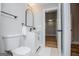 A well-lit bathroom features a toilet, vanity with storage, and bright white walls at 294 Clearview Ct, Villa Rica, GA 30180