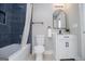 This bathroom features a tub/shower combo with blue tile and a white vanity at 294 Clearview Ct, Villa Rica, GA 30180